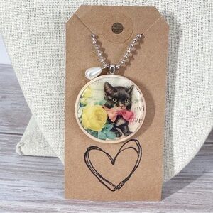 Round wood dimensional artisan cat pendant necklace 
22” stainless steel